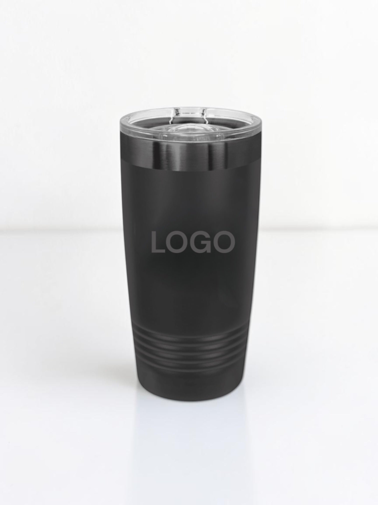 A matte black insulated travel tumbler with a clear plastic lid, featuring the word 'LOGO' printed on the front, set against a plain white background.