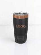 A matte black insulated travel tumbler with a clear lid, featuring a metallic rose gold band near the top and the word 'LOGO' printed in rose gold on the front, set against a clean white background.