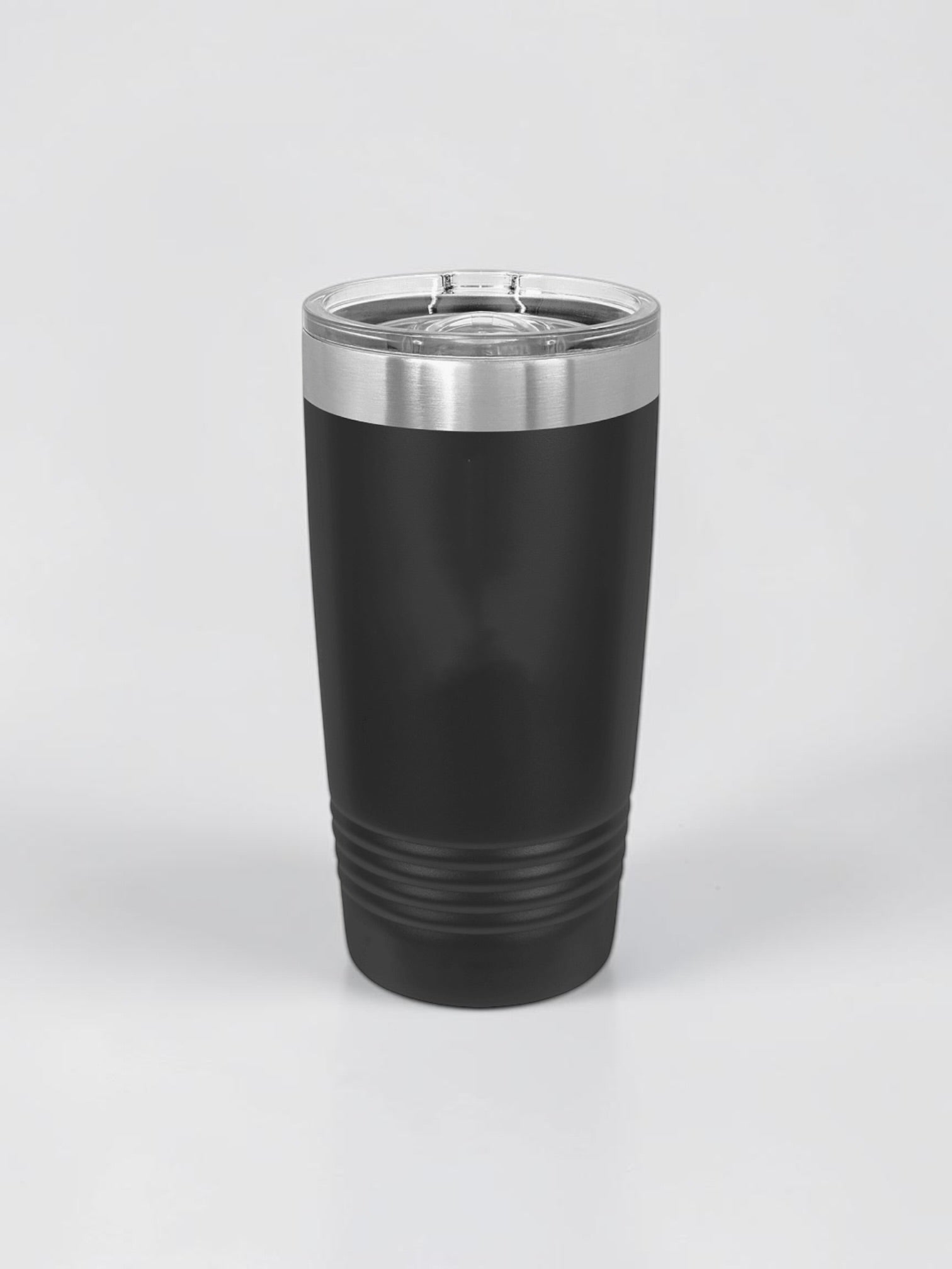 A matte black insulated travel tumbler with a stainless steel rim and a clear plastic lid, shown on a light gray background.