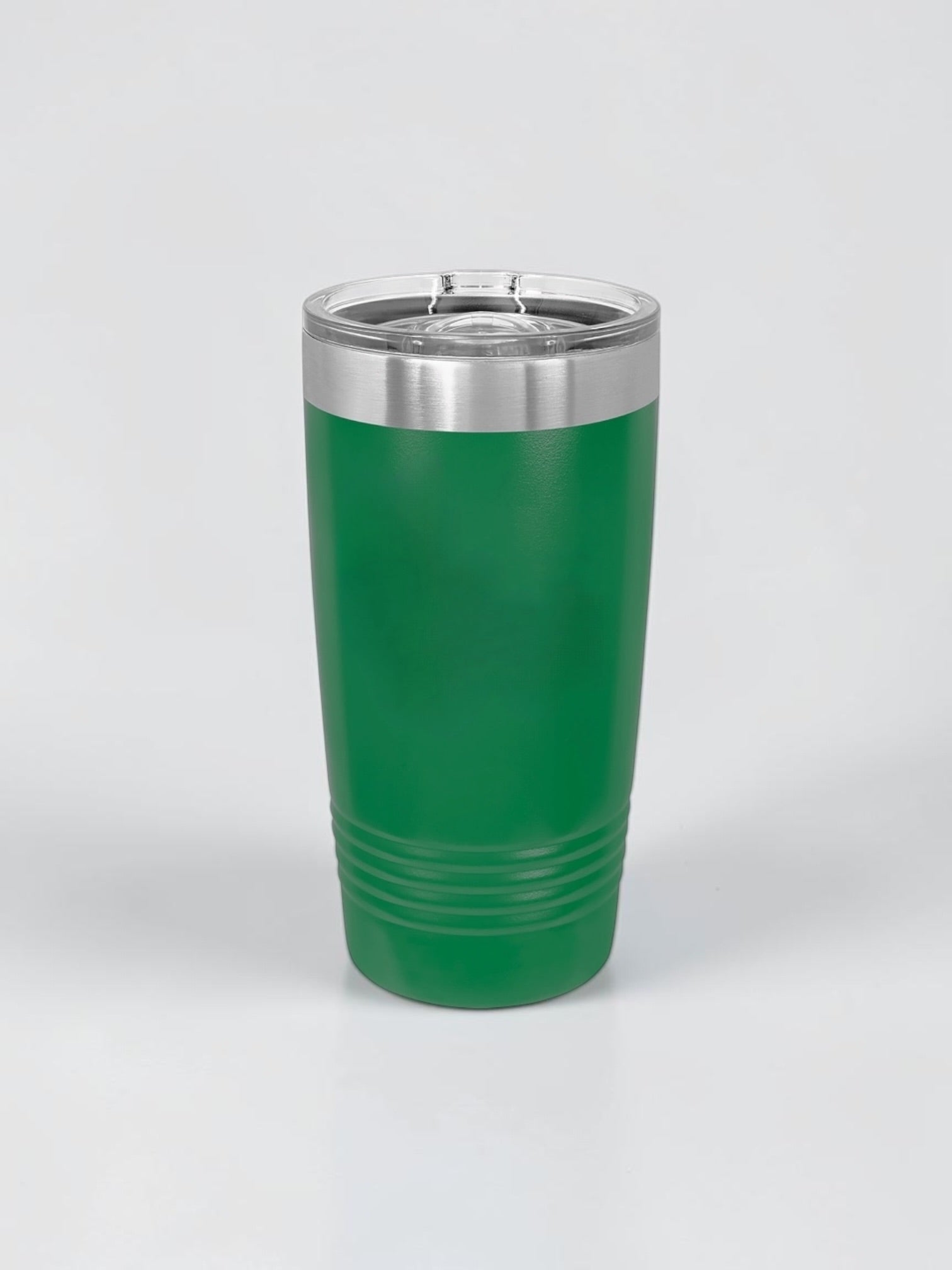 A green insulated travel tumbler with a stainless steel rim and clear lid, shown on a light gray background.
